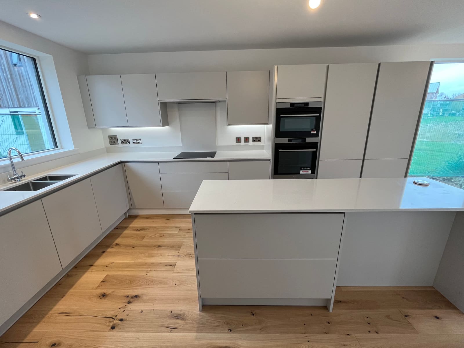 Kitchen with island and oak floor