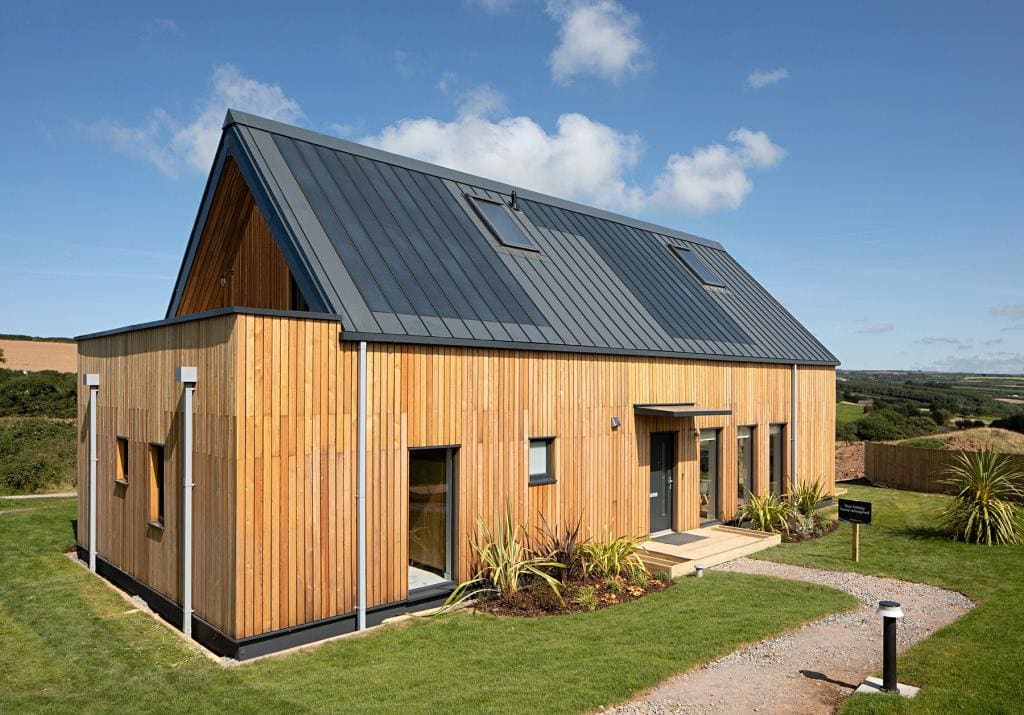 Entrance side of the house with solar panels in the roof