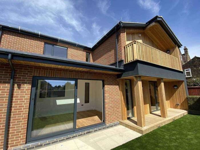Completed nHouse home with balcony and brick base