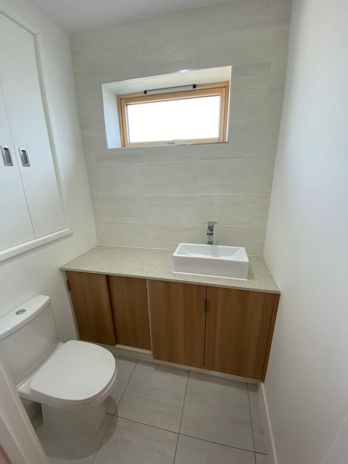 Cloakroom with timber vanity unit